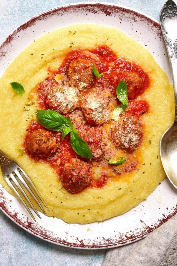 17 Best Tube Polenta Recipes featuring Homemade Polenta with Meatballs in Tomato Sauce
