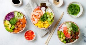 Homemade Sushi Bowls with Tuna, Shrimp, Avocados, Mangoes and Beets