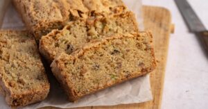 Homemade Zucchini Bread with Nuts in a Wooden Cutting Board
