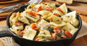 Homemade Lobster Ravioli with Tomatoes and Spinach