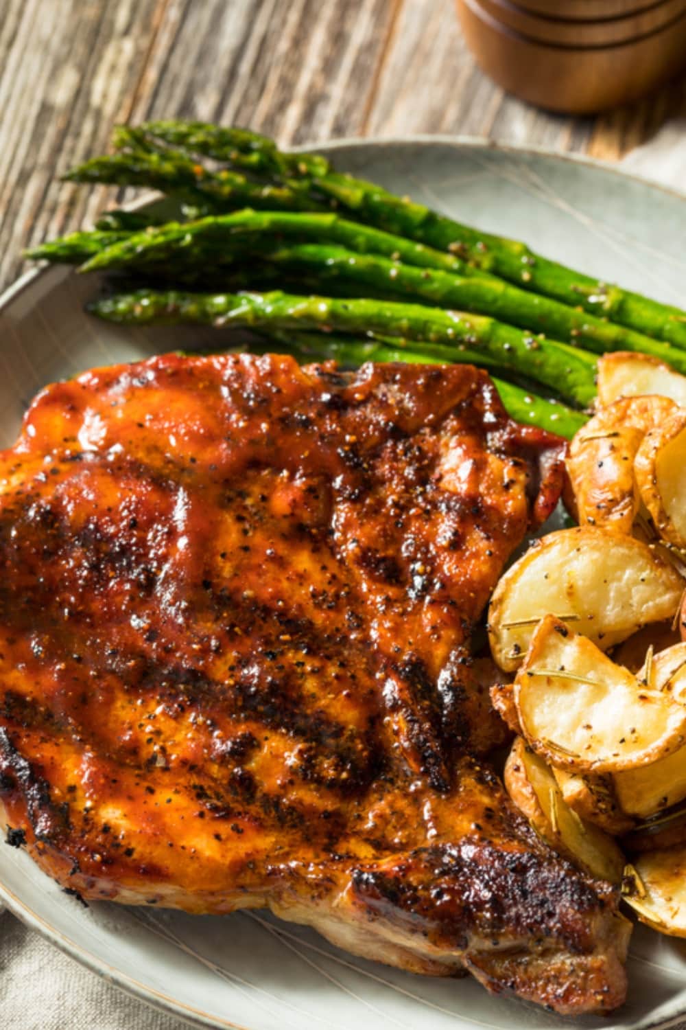 Honey Garlic Porkchops Served with Asparagus and Roasted Potatoes