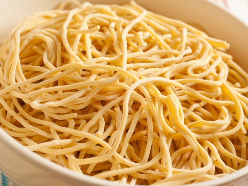 Raw Uncooked Lo Mein Noodles on a Bowl
