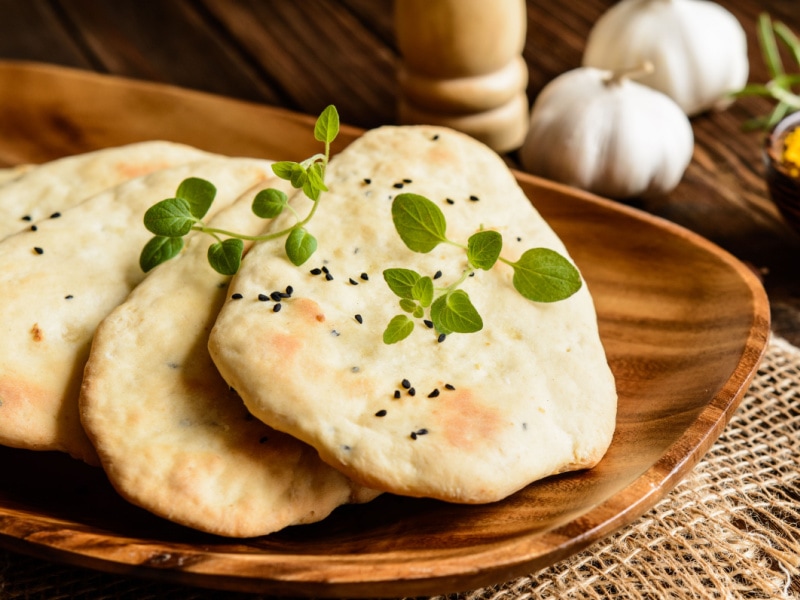 Homemade Naan on a Wooden Plate