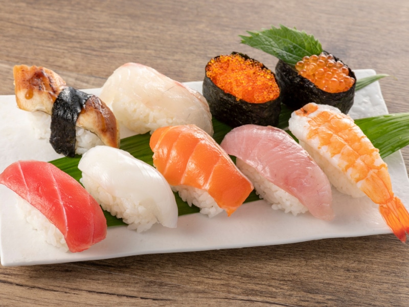 Assorted Fresh Nigiri Sushi on a White Sushi Plate
