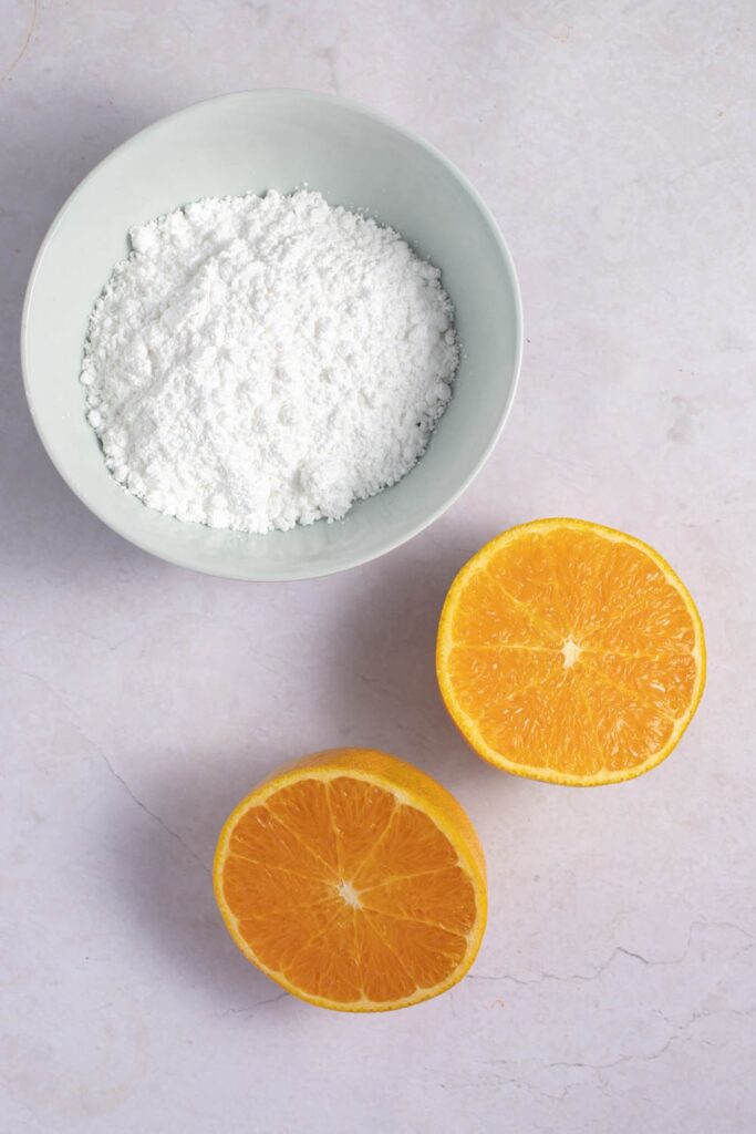 Orange Glaze Icing Ingredients - Confectioner's Sugar and Oranges