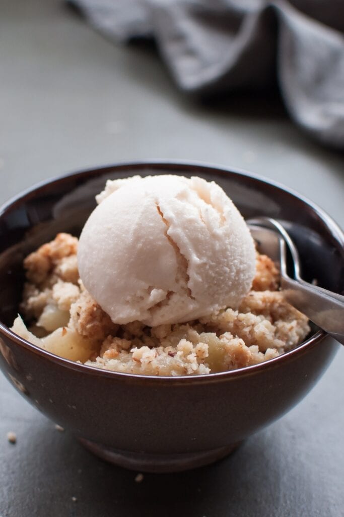  BEST Canned Pear Recipes featuring Pear Crumble with Ice Cream in a Bowl