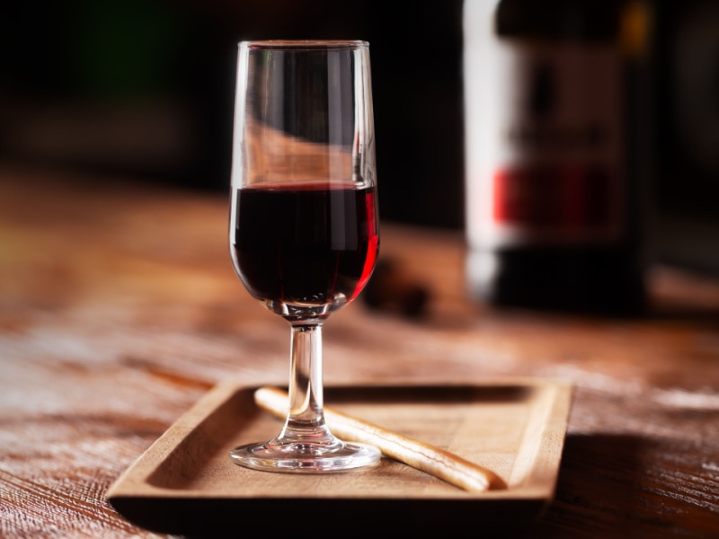 A Glass of Port Wine on a Wooden Table