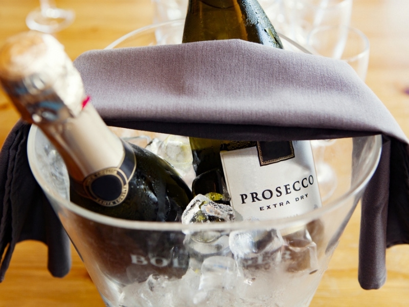 Prosecco Bottle Over Ice on a Glass Bucket