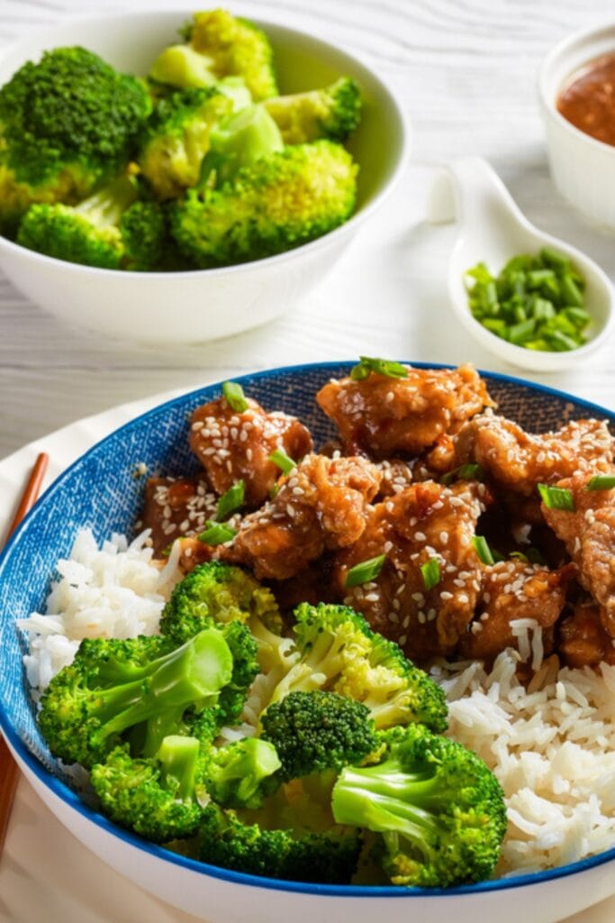 Rice in a Bowl Topped With Tso's Chicken and Microwave Steamed Broccoli