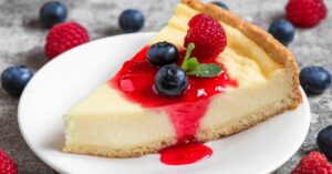 Sliced Sweet New York Cheesecake with Berries