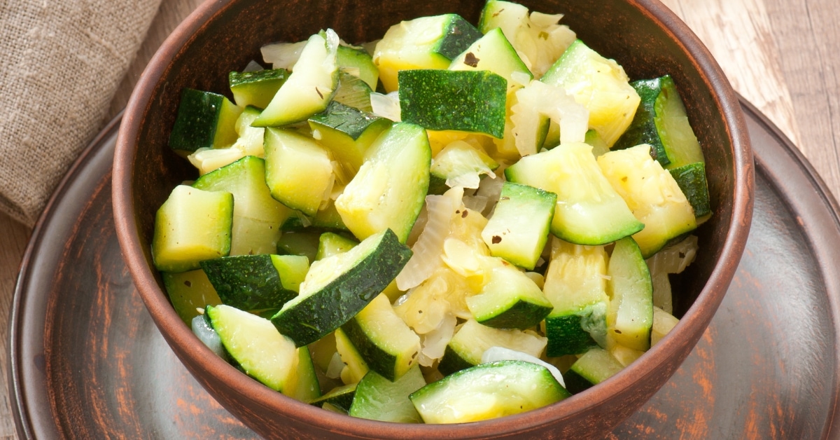 Steamed Zucchini with Spices in a Wooden Bowl