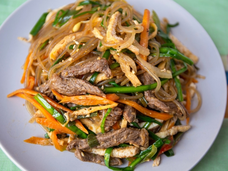 Servings of  Stir-Fried Glass Noodles With Vegetables and Meat