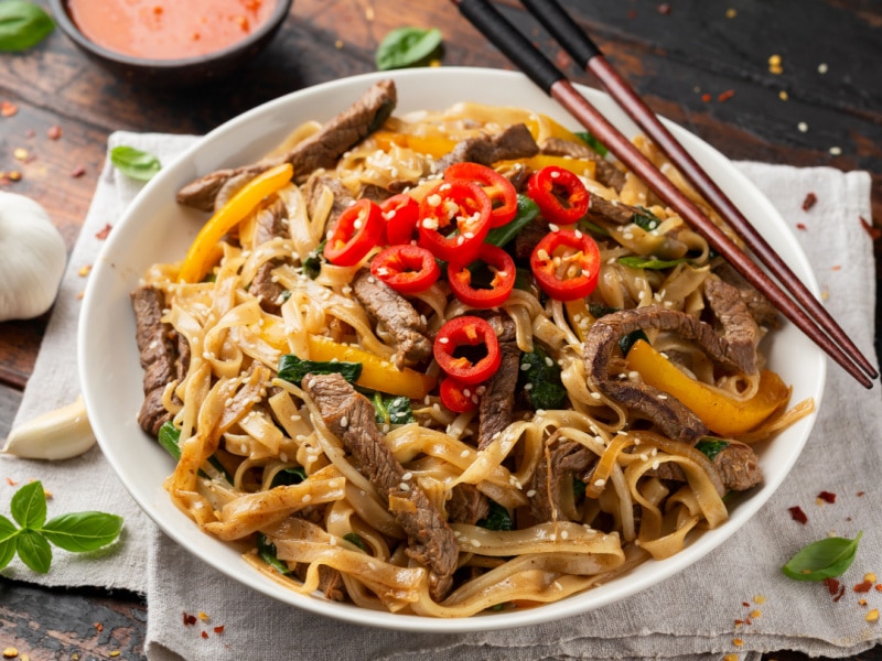 Stir Fry Beef Chow Fun with Rice Noodles Bean Sprouts Spring Onions and Chilis