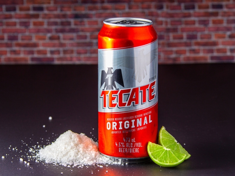 Can of Tecate Beer With Salt and Lime Wedges