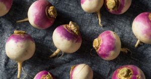 Raw Organic Purple Turnips on a Blue Cloth