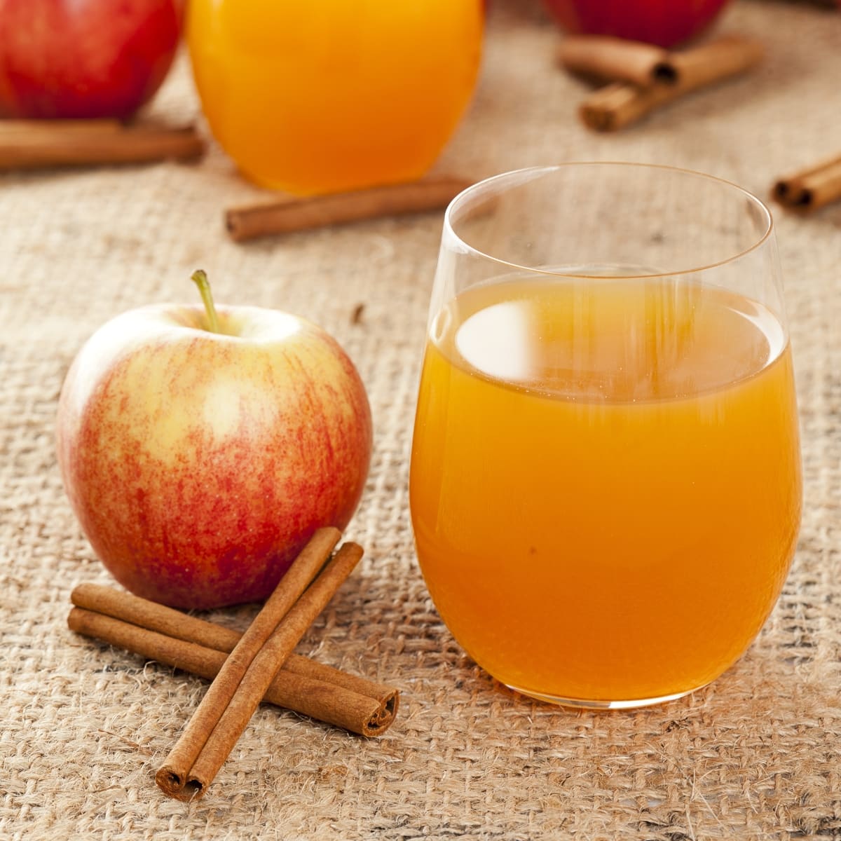 Organic Fresh Apple Juice, Cinnamon Sticks and Fresh Apple