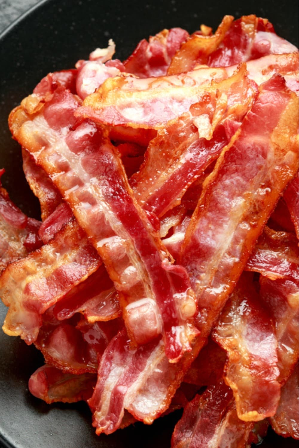 How Long to Bake Bacon at 350 (Easy Recipe) featuring Pile of Baked Bacon Strips