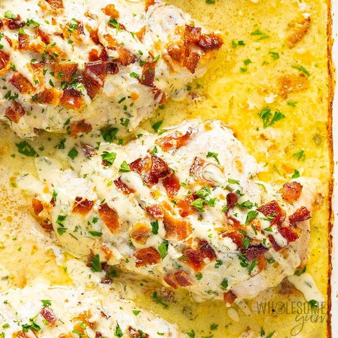 Baked cheesy bacon ranch chicken on a casserole dish. 