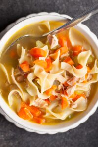Bowl of Homemade Chicken Noodle Soup with Carrots