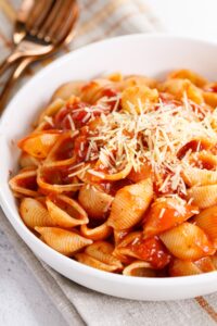 Bowl of Homemade Pasta with Tomato Sauce and Cheese