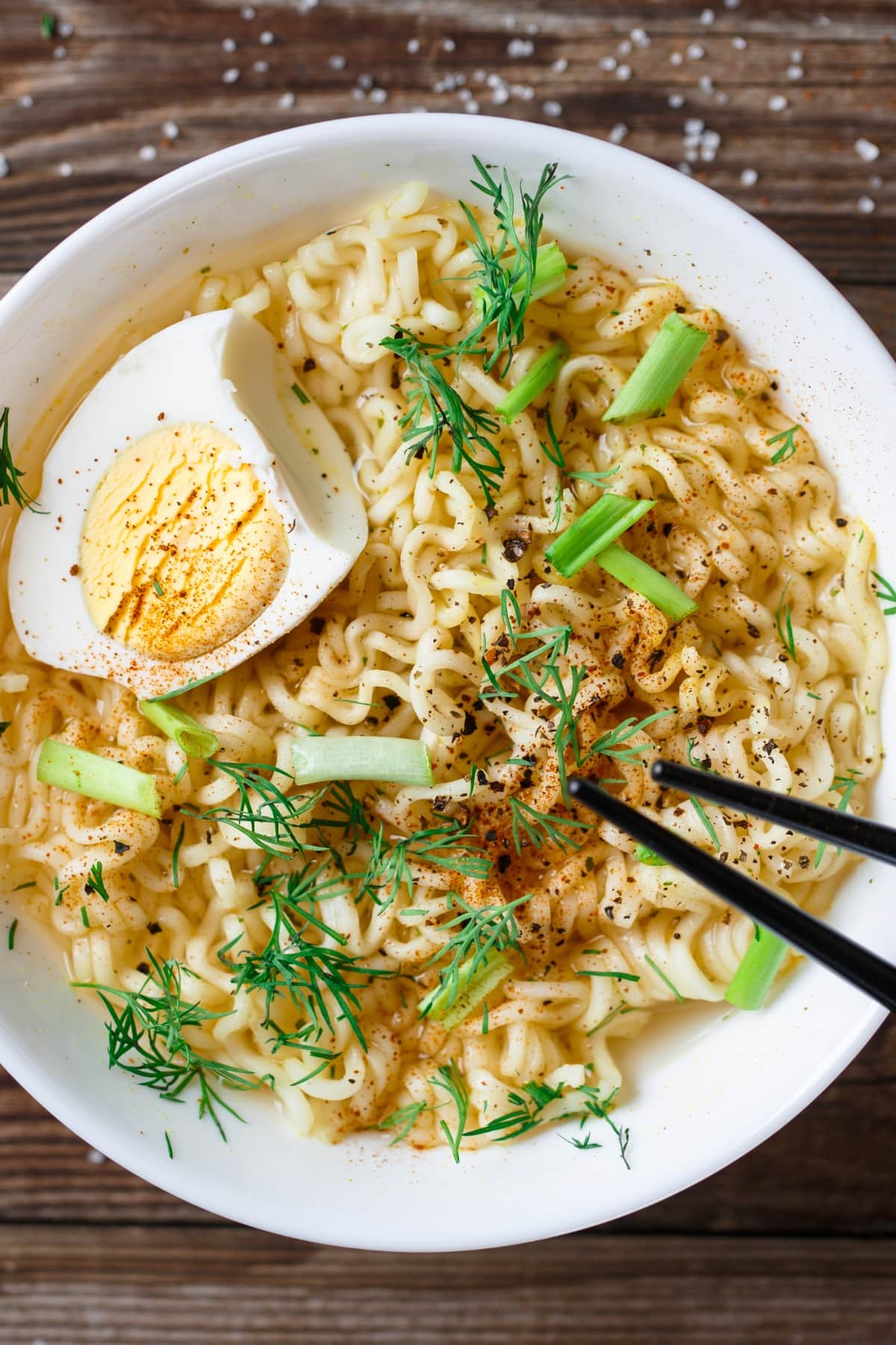 How to Cook Ramen Noodles in the Microwave featuring Bowl of Homemade Ramen Noodles with Hard-Boiled Egg, Chives, and 
Dill