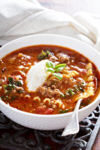 Bowl of Homemade Crockpot Lasagna Soup with Whipped Cream