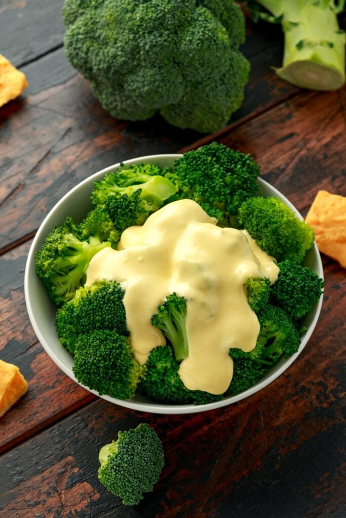 17 Best Sauces for Broccoli (+Easy Recipes) featuring Broccoli with Cheese Sauce in a Bowl