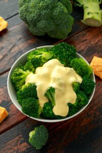Broccoli with Cheese Sauce in a Bowl