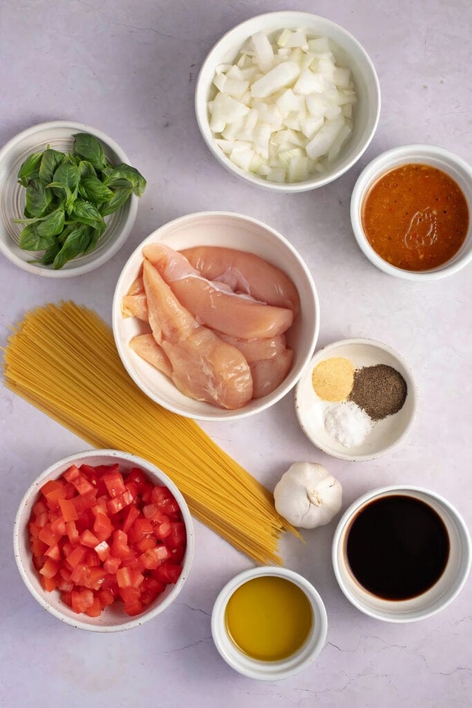 Ingredients for Bruschetta Chicken Pasta - Chicken Breast, Italian Salad Dressing, Seasonings, Llama Tomatoes, Basil, Garlic, Salt, Black Pepper, Vegetable Oil, Angel Hair Pasta, Olive Oil