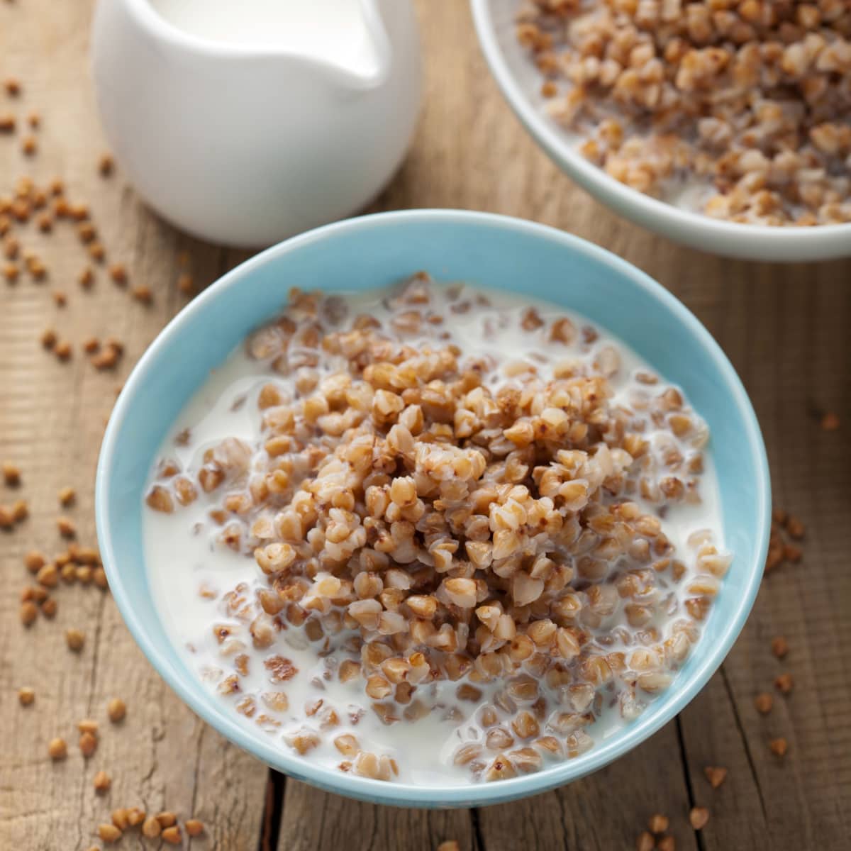 A Bowl Buckwheat Groats with Milk on a Wooden Table