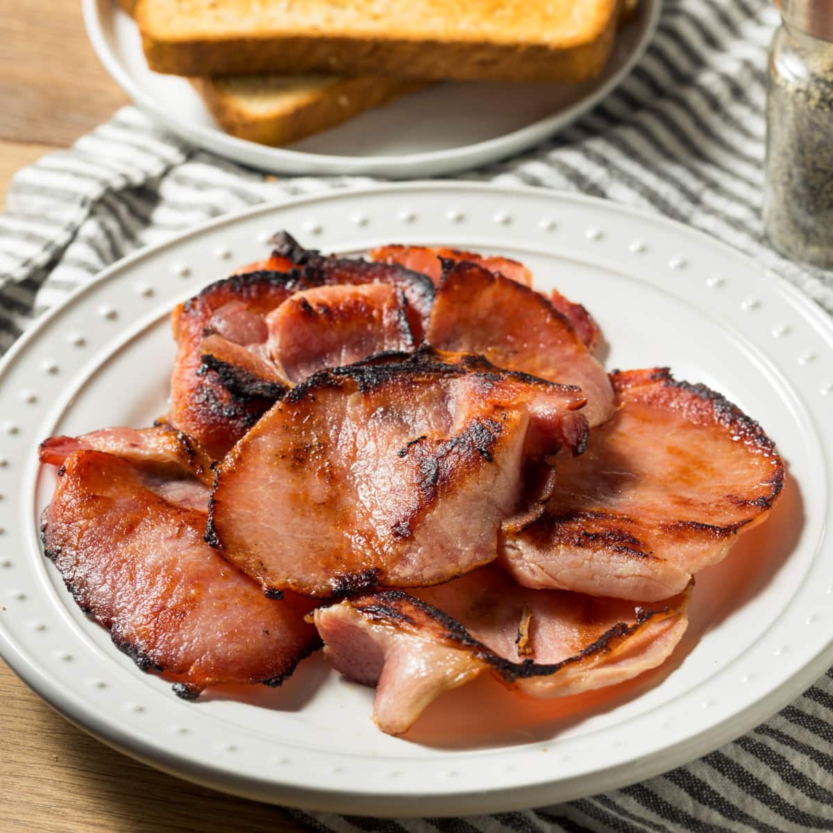 Canadian Bacon on Plate With Toasted Bread