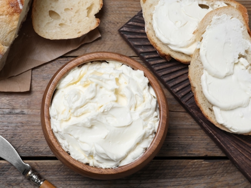 Bread and Wooden Bowl With Cream Cheese