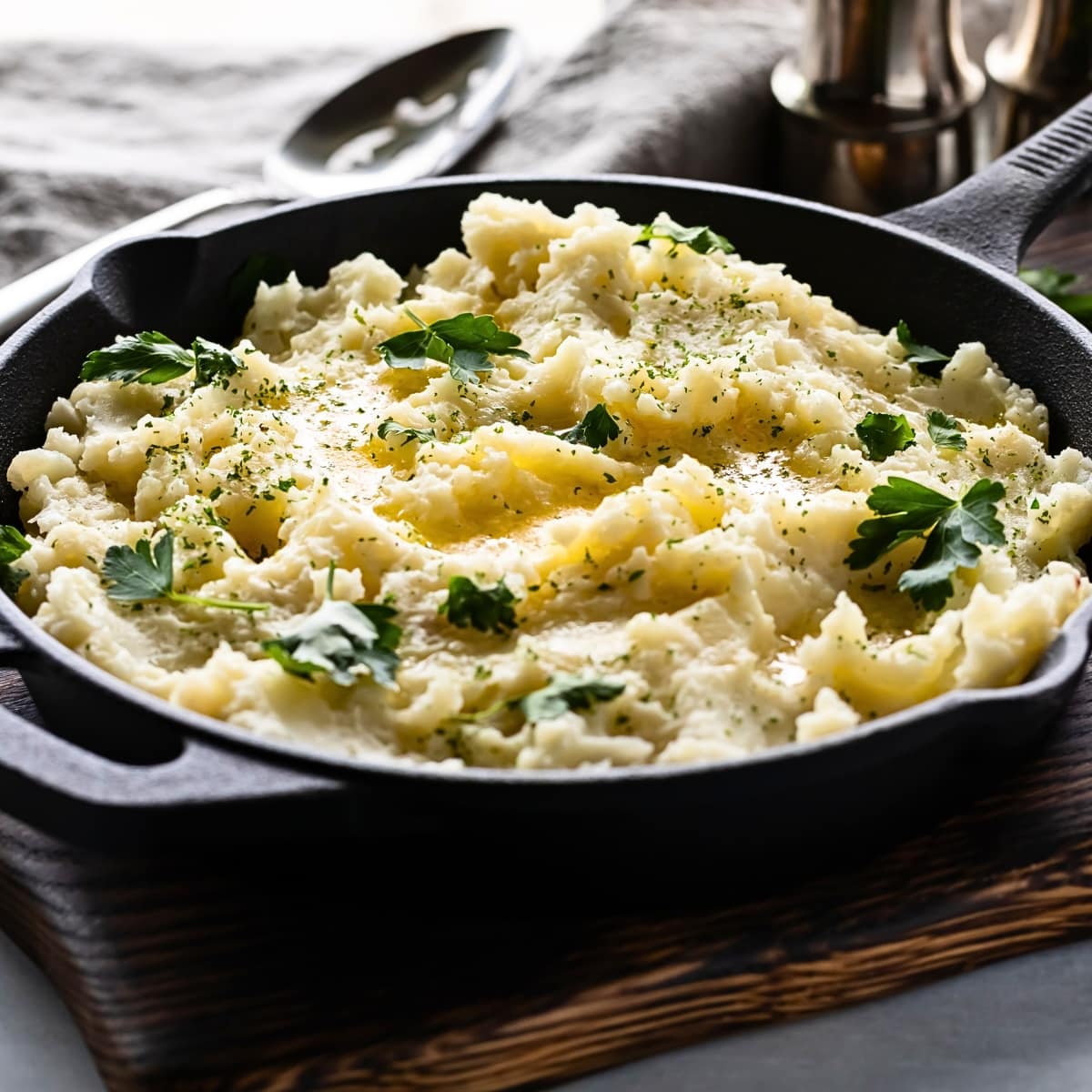Mashed Potatoes in Skillet with Butter and Herbs