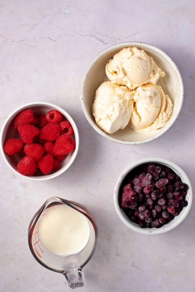 Grimace Shake Ingredients - Vanilla Ice Cream, Blueberries, Raspberries, and Milk