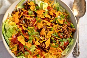 Taco Salad with ground beef, Nacho's, and Catalina dressing
