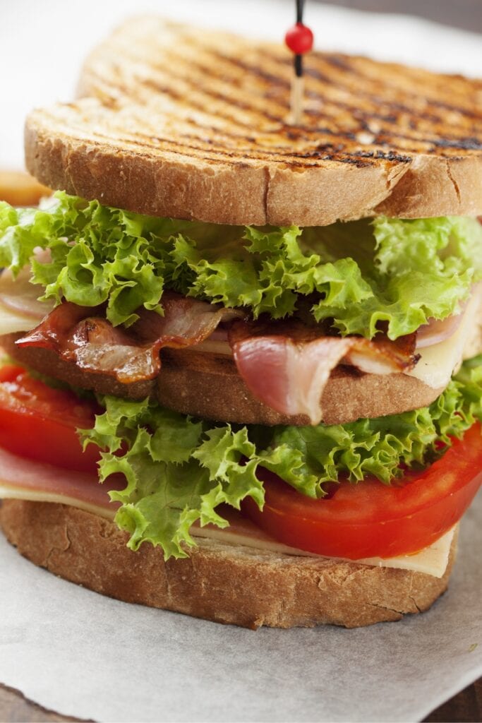 Ham and Bacon Sandwich with Tomatoes and Lettuce