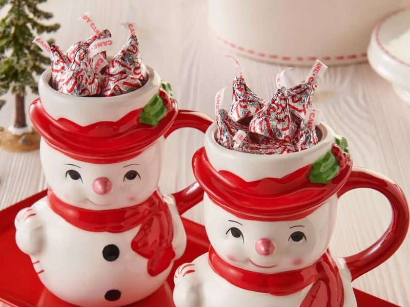 Two Adorable Snowman Vases Filled With Candy Cane Flavored Hershey's Kisses 