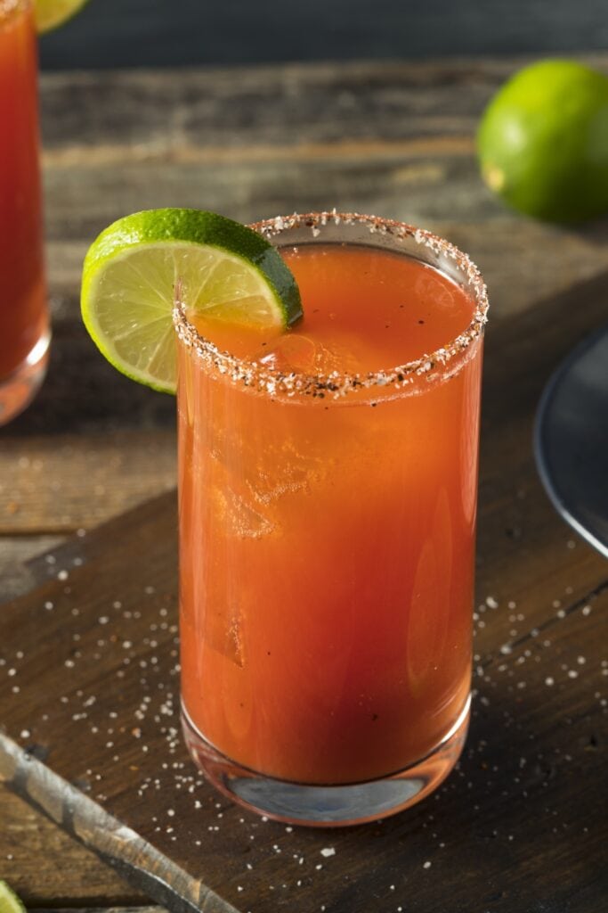 13 Easy Beer Cocktails That Taste Amazing featuring Homemade Beer Michelada Cocktail with Lime and Salt and Tajin Rim