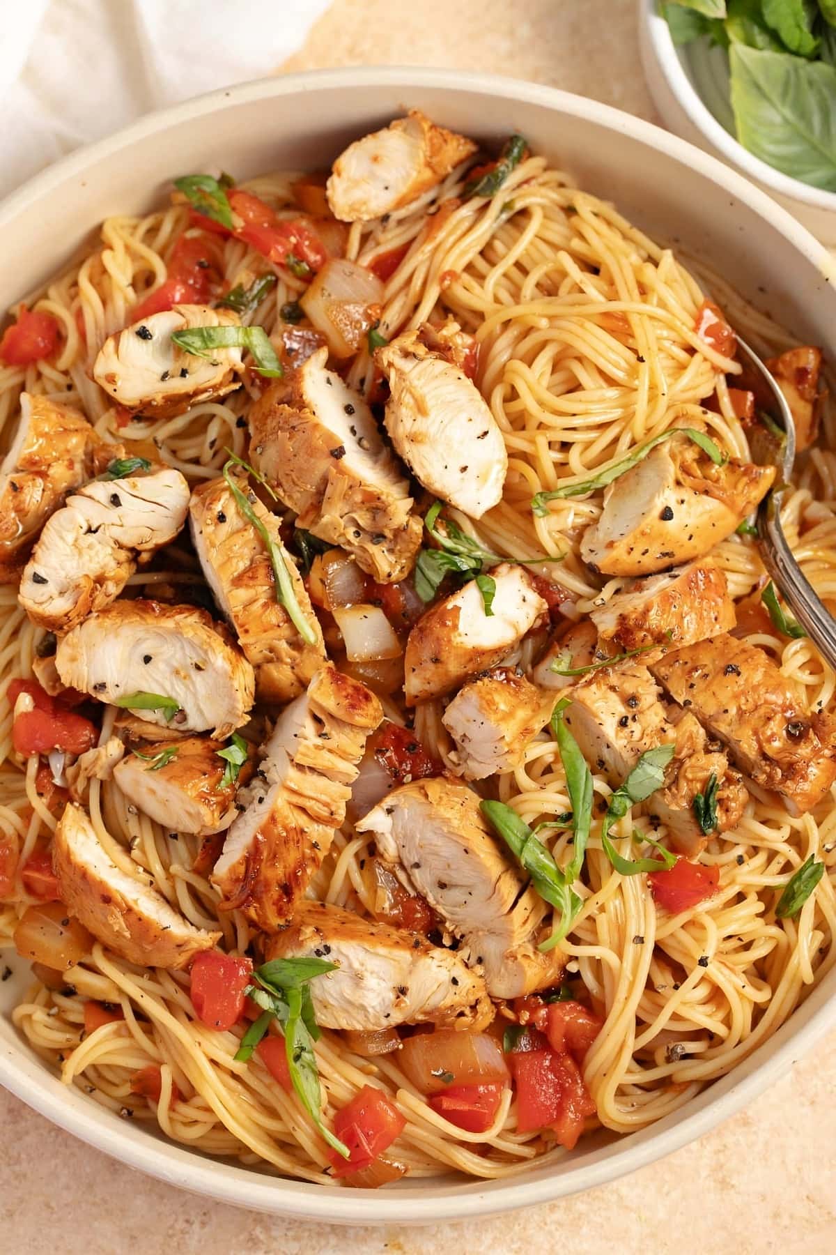 Homemade Bruschetta Chicken Pasta with Tomatoes and Basil in a Bowl