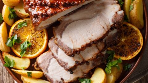 Homemade Christmas Baked Pork with Potatoes, Lemon and Apples