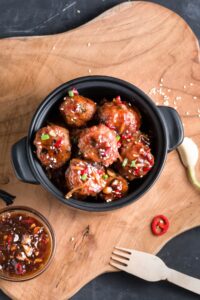 Homemade Teriyaki Meatballs in a Black Pot