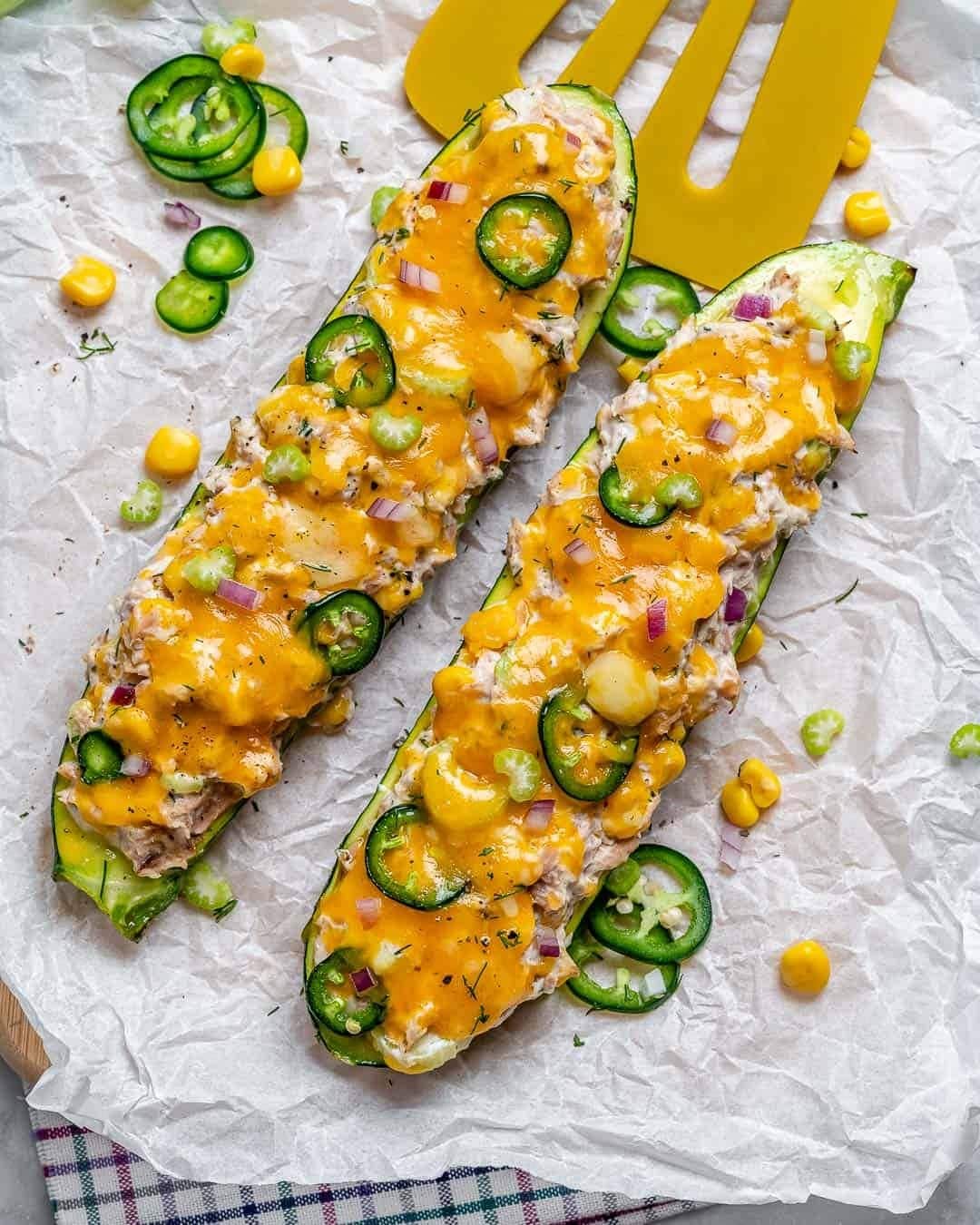 Zucchini boats topped with tuna and melted cheese on top. 