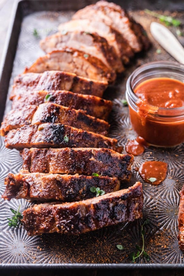 Sliced oven-baked ribs with sauce. 