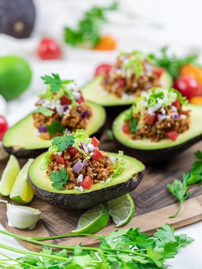 Avocado halves topped with taco filling. 