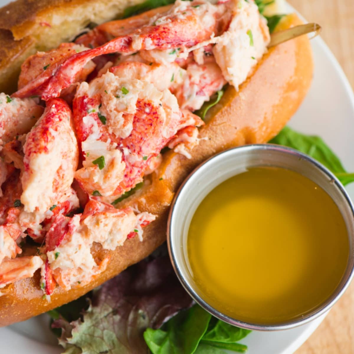 Lobster Roll With Drawn Butter on Sides