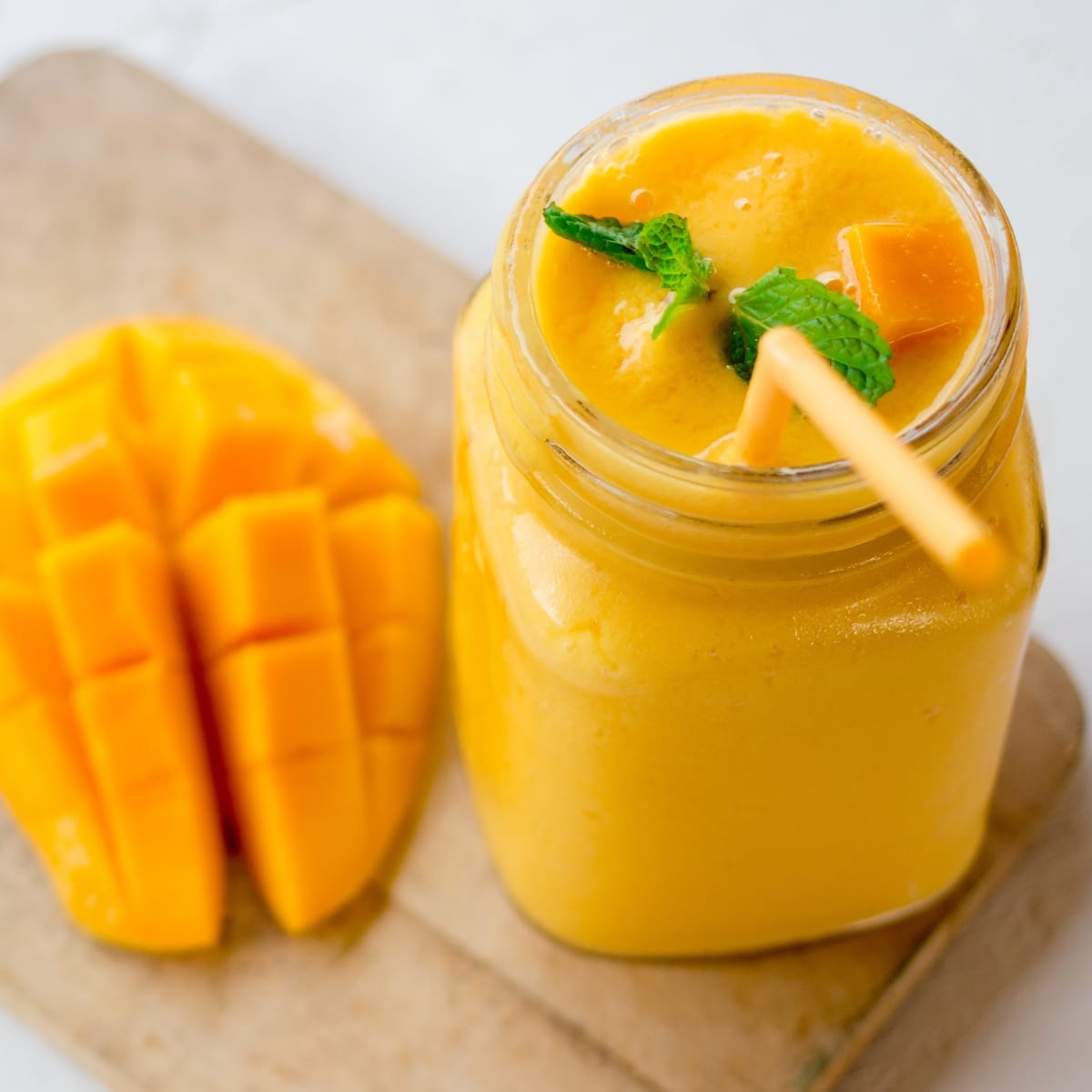 Ripe Mango and Fresh Smoothie on a Mason Jar