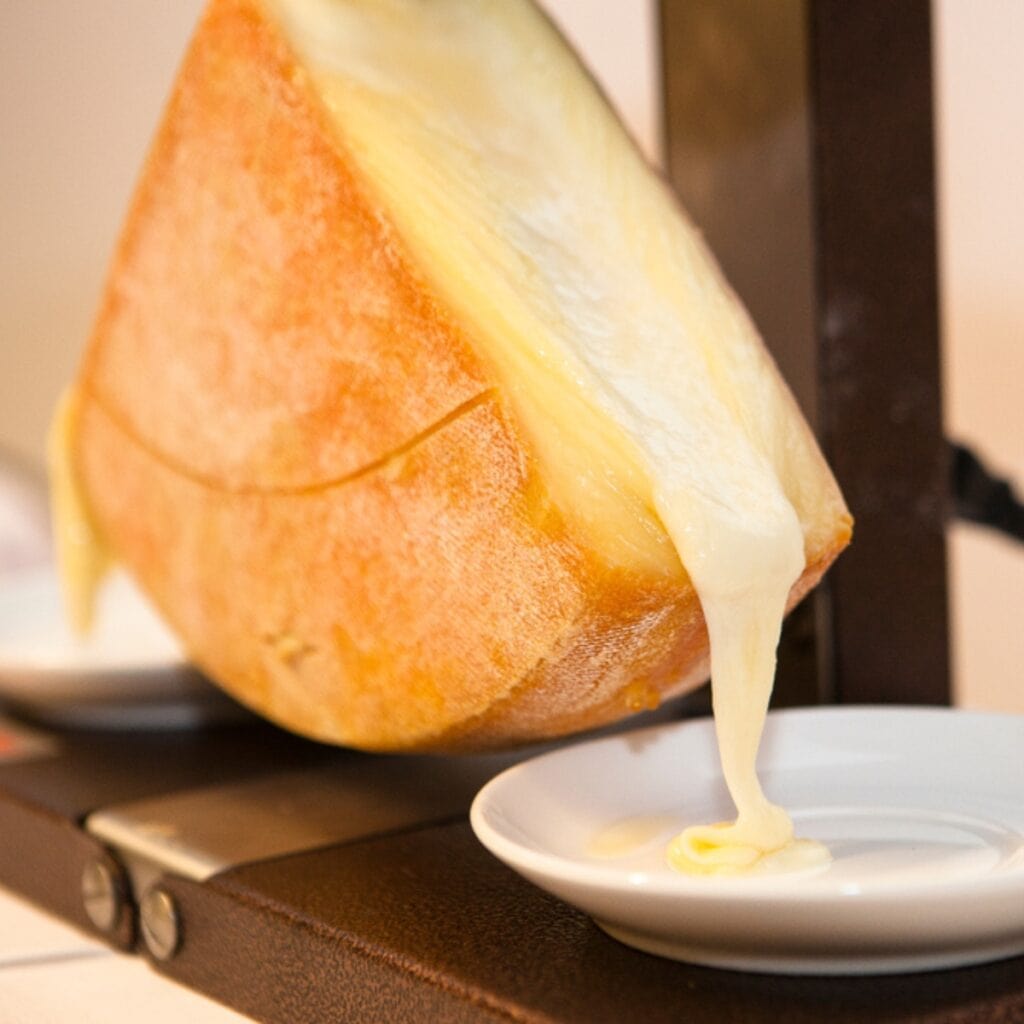 Melted Raclette Cheese Poured to a Saucer