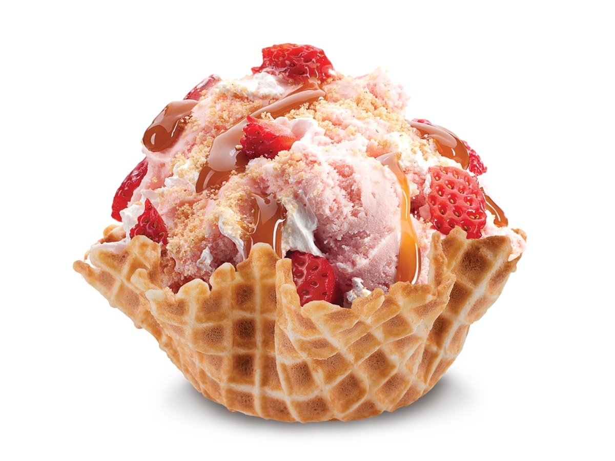 Our Strawberry Blonde Cold Stone Ice Cream with Strawberry Ice Cream, Graham Cracker Pie Crust, Fresh Strawberries, Caramel Sauce, and Whipped Cream in a Waffle Bowl