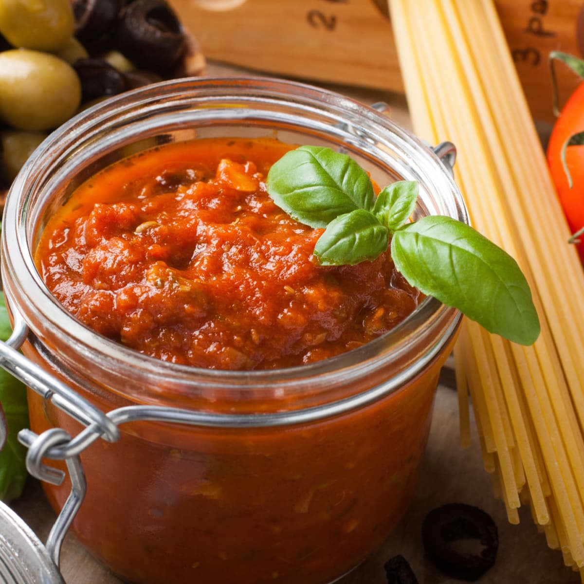 Homemade Pasta Sauce in a Jar with Raw Pasta on the Side