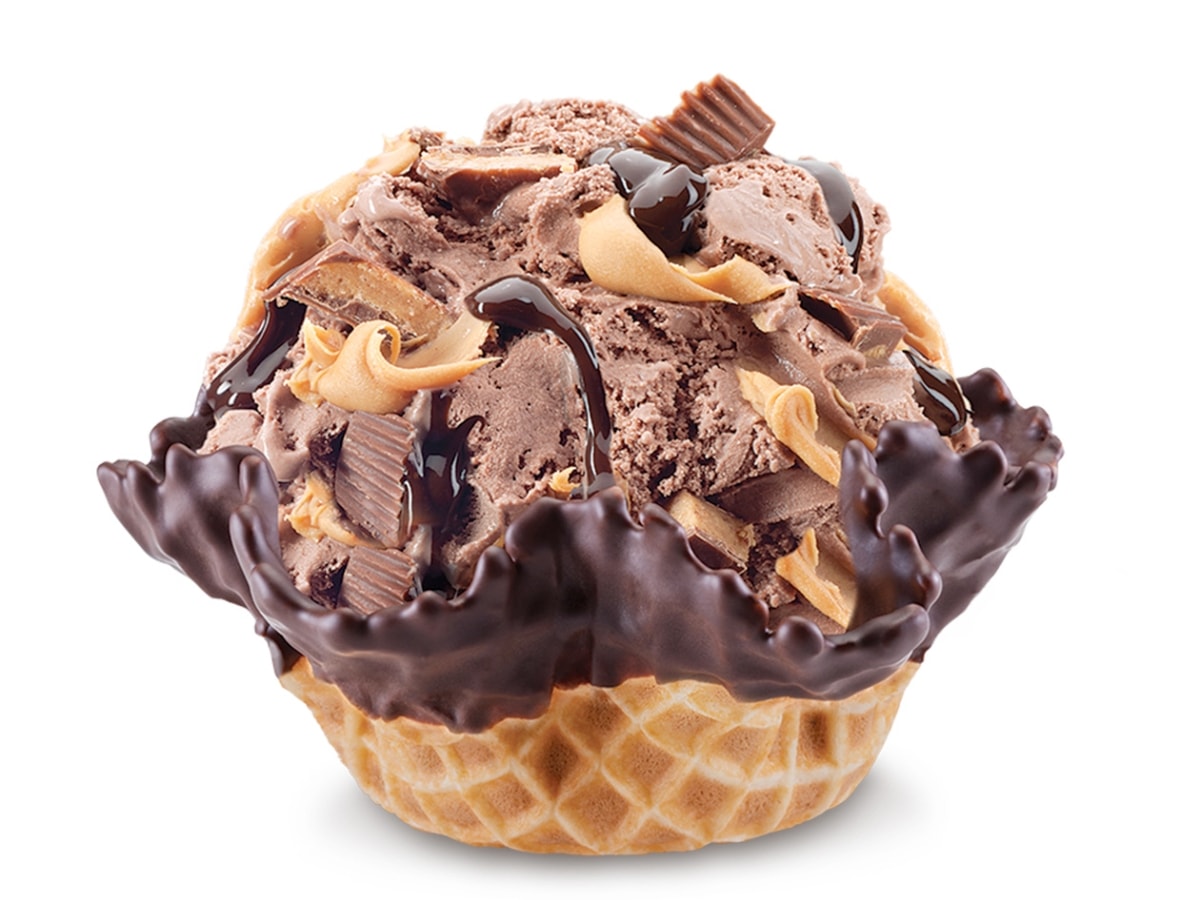 Peanut Butter Cup Perfection Cold Stone Flavor with Chocolate Ice Cream, Peanut Butter, Chunks of Reese's Cups, and Fudge in a Chocolate-Dipped Bowl